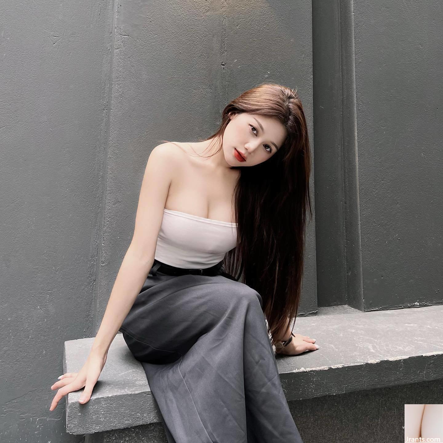 Cô gái cao ráo xinh đẹp với những đường cong cắt thấp hoàn hảo